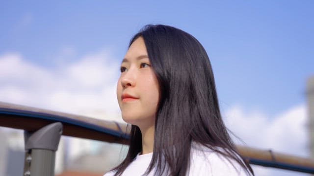 Woman walking on a bridge outdoors