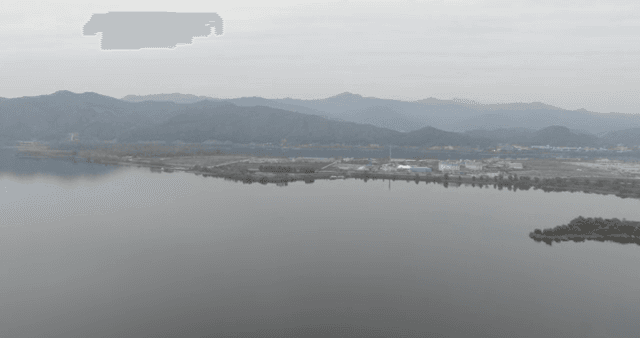A calm river with distant mountains