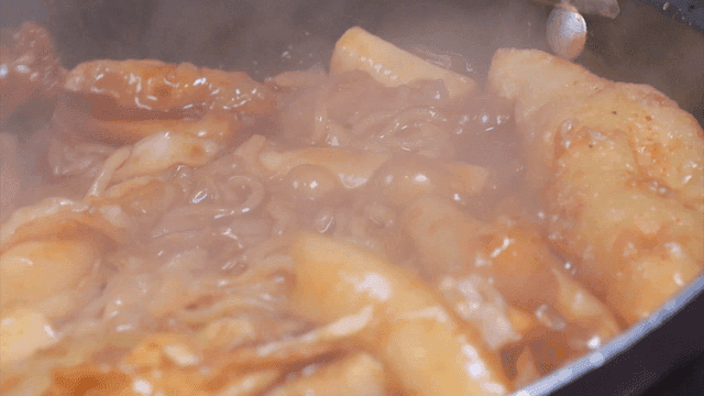 Spicy tteokbokki simmering in a pot