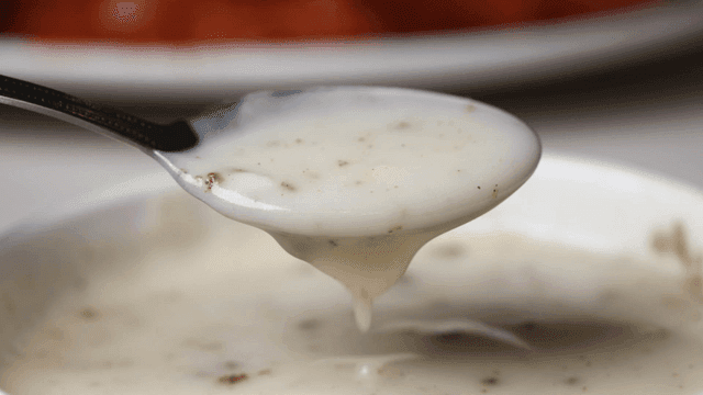 Bowl of cream soup with spoon