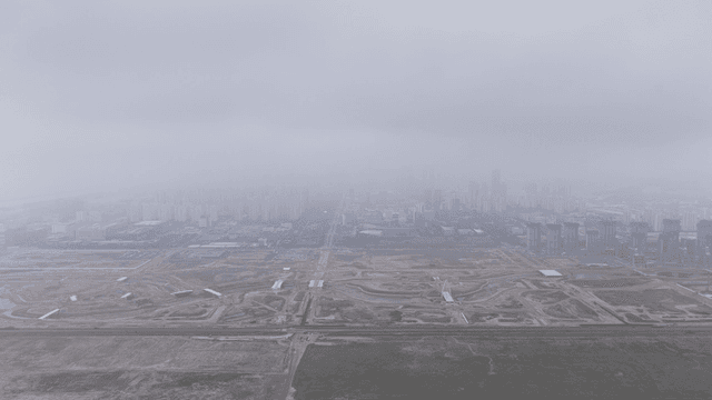Foggy cityscape with construction sites