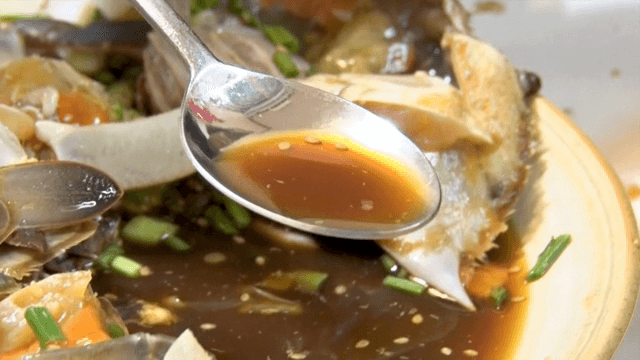 A spoonful of soy sauce from Soy Sauce Marinated Crab