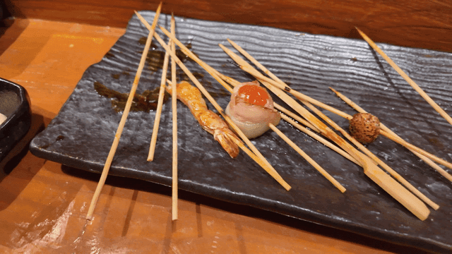 Variety of empty skewers placed on plate