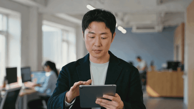 Office worker holding tablet
