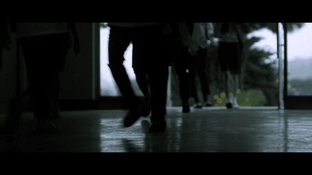 Students going to school through dark hallway
