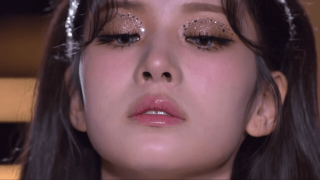 Woman's face with sparkling eye makeup