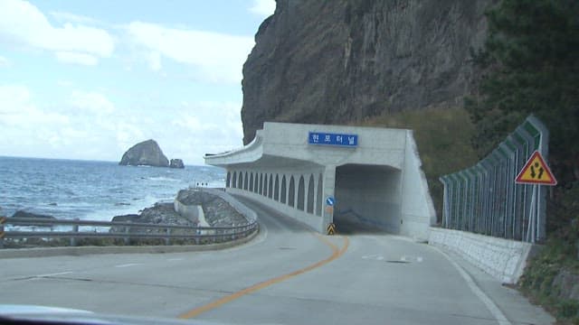 Driving Along a Coastal Road by the Sea