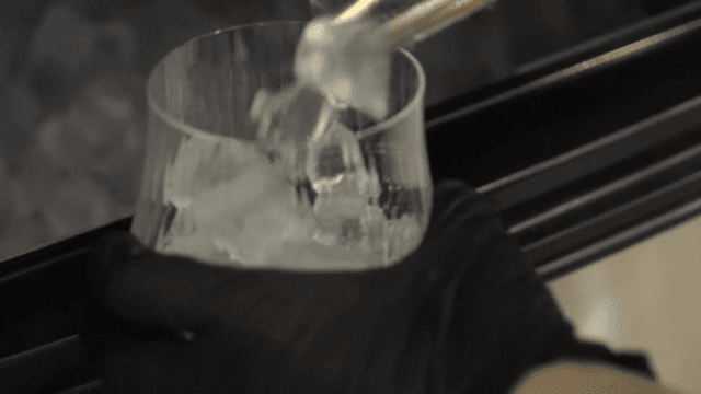Ice being placed into a glass