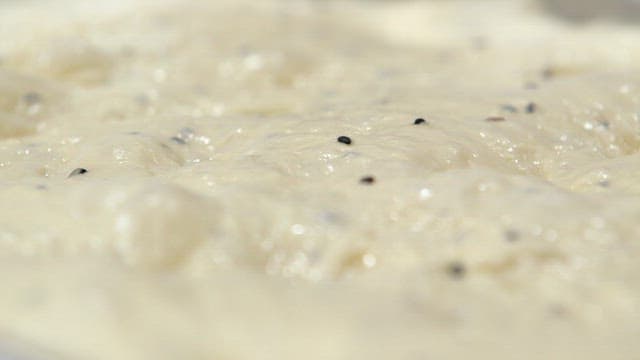 Bubbling dough with black sesame seeds