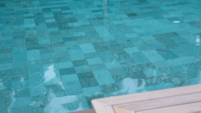 Clear swimming pool with tiled floor