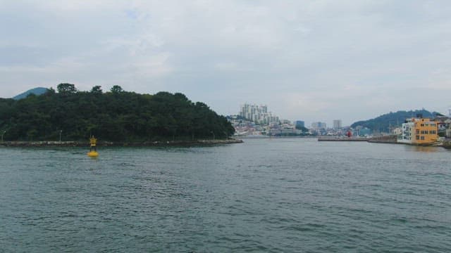 Coastal city with a bridge and buildings