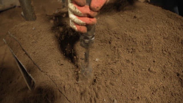 Scene of soil being compacted with a machine