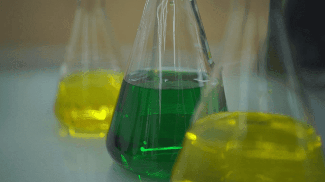 Colorful liquids in laboratory flasks