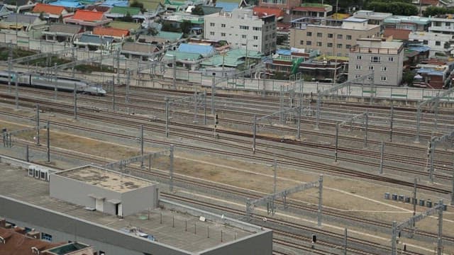 High-speed train passing through railways near residential areas