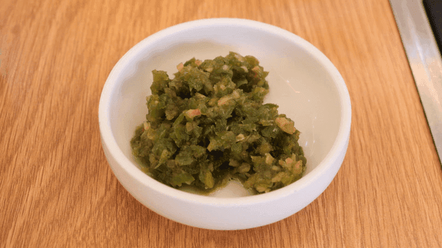 Small plate containing minced chili seasoning