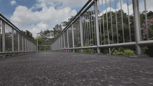 Pedestrian bridge with metal railings