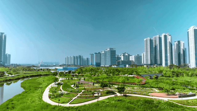 Modern city skyline with green park.