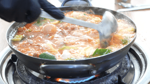 Spicy chicken offal stew boiling in pot