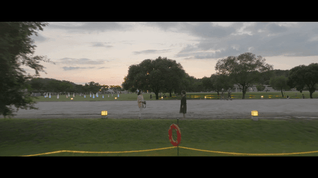Two women looking at each other in evening park