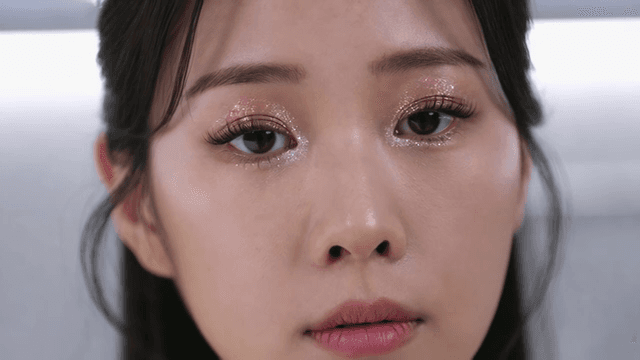 Woman with glittery eye makeup