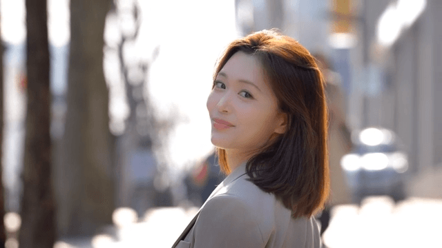 Working woman smiling on sun-drenched street