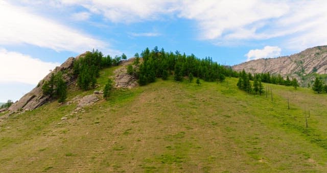 Landscape of rocky mountains with greenery