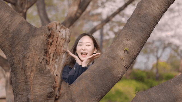 Woman on a date in a park with a happy expression
