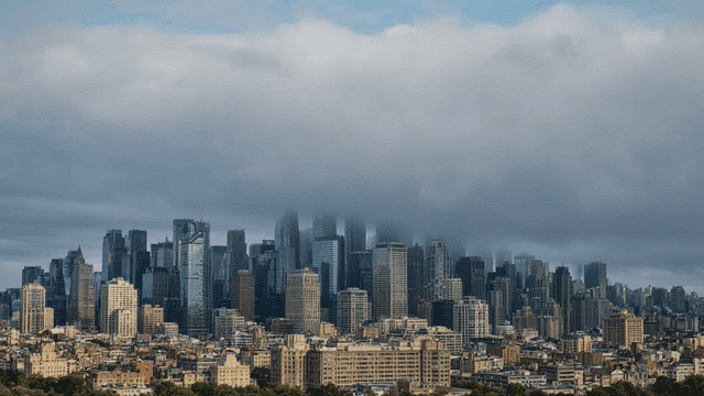 City skyline with moving clouds