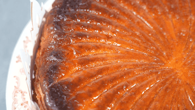 Glossy caramel dessert on plate.