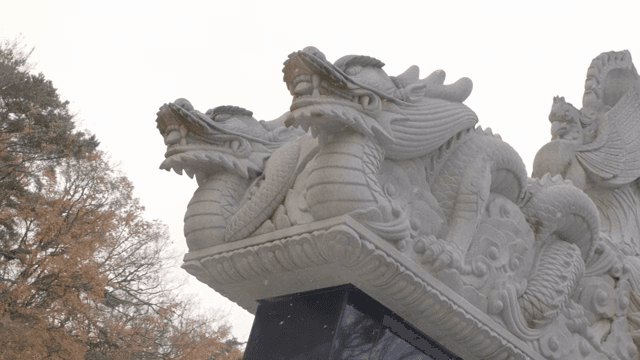 Stone dragon sculpture in a serene park
