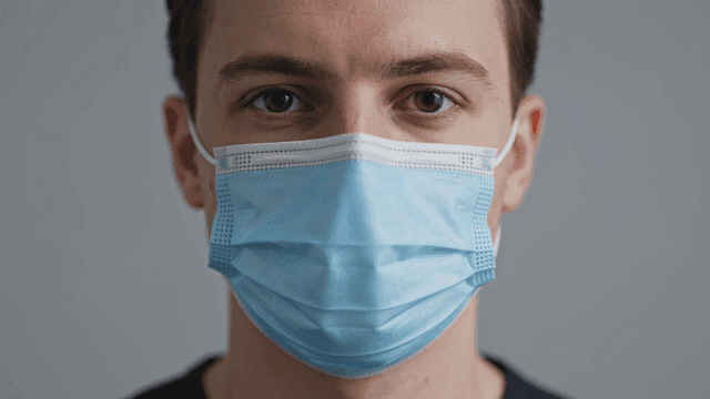 White man wearing mask