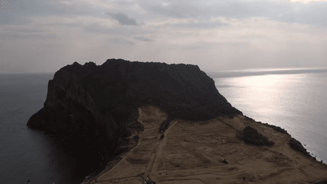 A scenic island with a rocky cliff