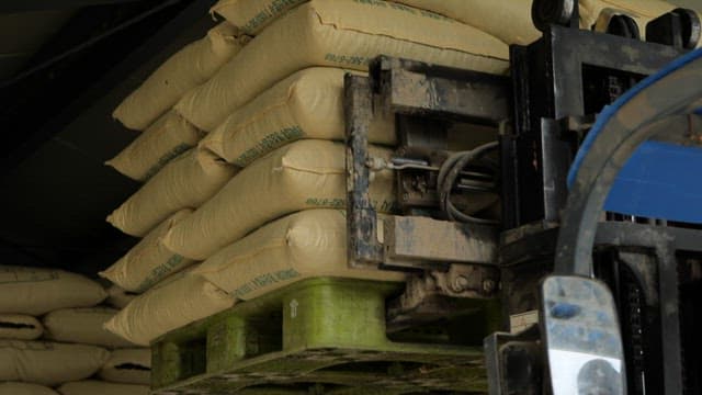 Multiple sacks of rice being transported from a warehouse