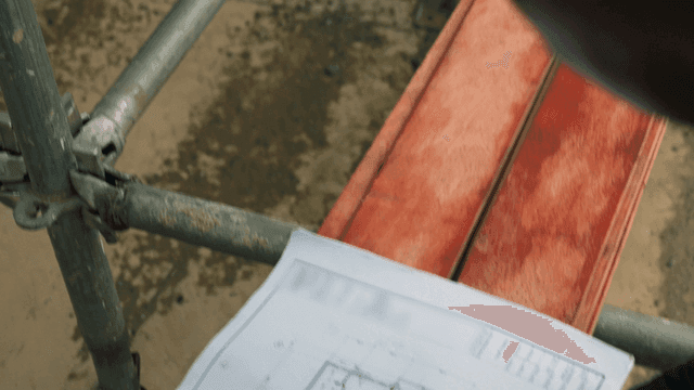Person reviewing construction blueprints