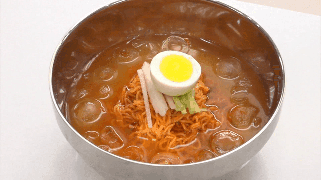 Cold bibim ramen cold noodle bowl with egg and ice