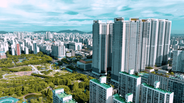 Vibrant cityscape with tall buildings and parks
