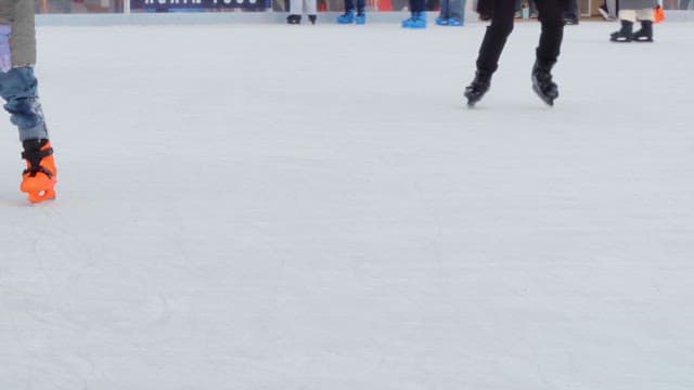 People ice skating on a rink