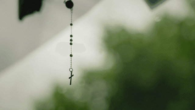 Cross pendant hanging somewhere