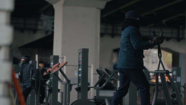 People exercising under a bridge