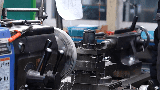 A lathe machine operating in a workshop