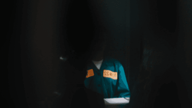 Prisoner being interrogated in dark room