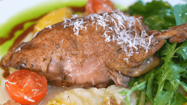 Delicious duck confit served with vegetables