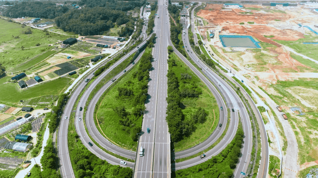 Aerial view of a highway with surrounding fields