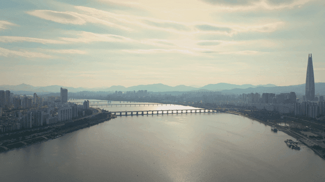 A city skyline with a river and bridges