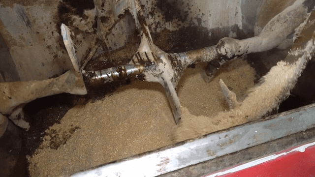 Mixing machine processing grain mixture