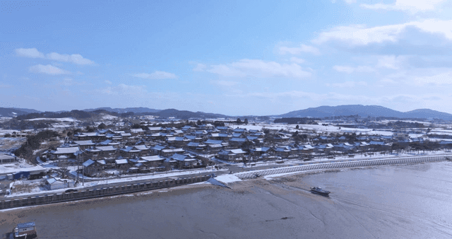 Snow-covered traditional Hanok village