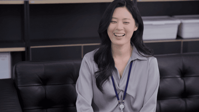 A woman smiling in an office setting