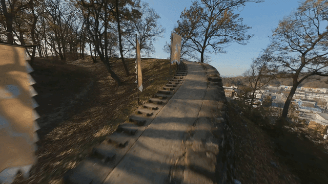 A scenic path with flags and autumn trees