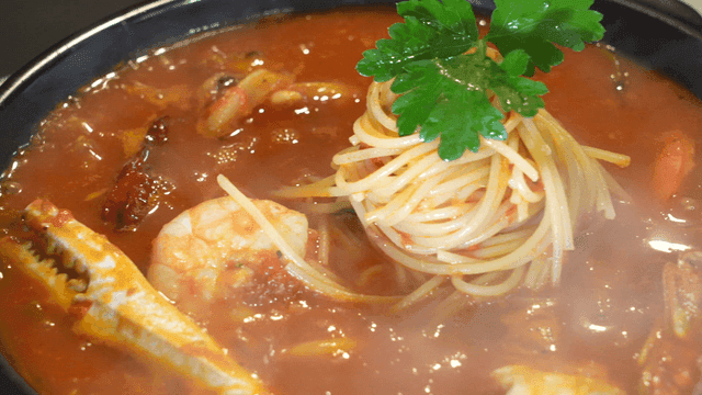 Seafood pasta in rich tomato broth