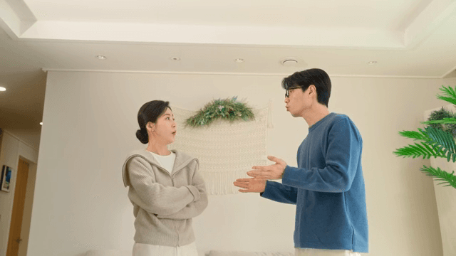 Couple arguing in the living room